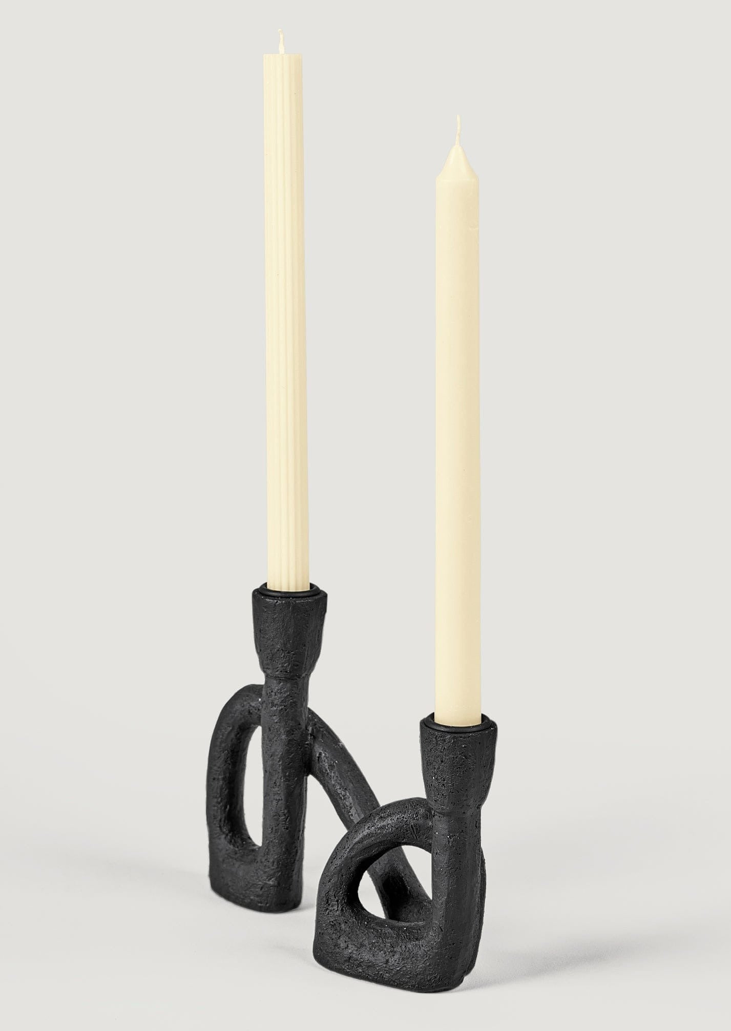 https://www.afloral.com/cdn/shop/files/Black-Double-Taper-Candle-Holder-Styled-with-Cream-Candles_01cef510-4cd2-482d-8ce5-f03f219170e7.jpg?v=1700071298&width=1500