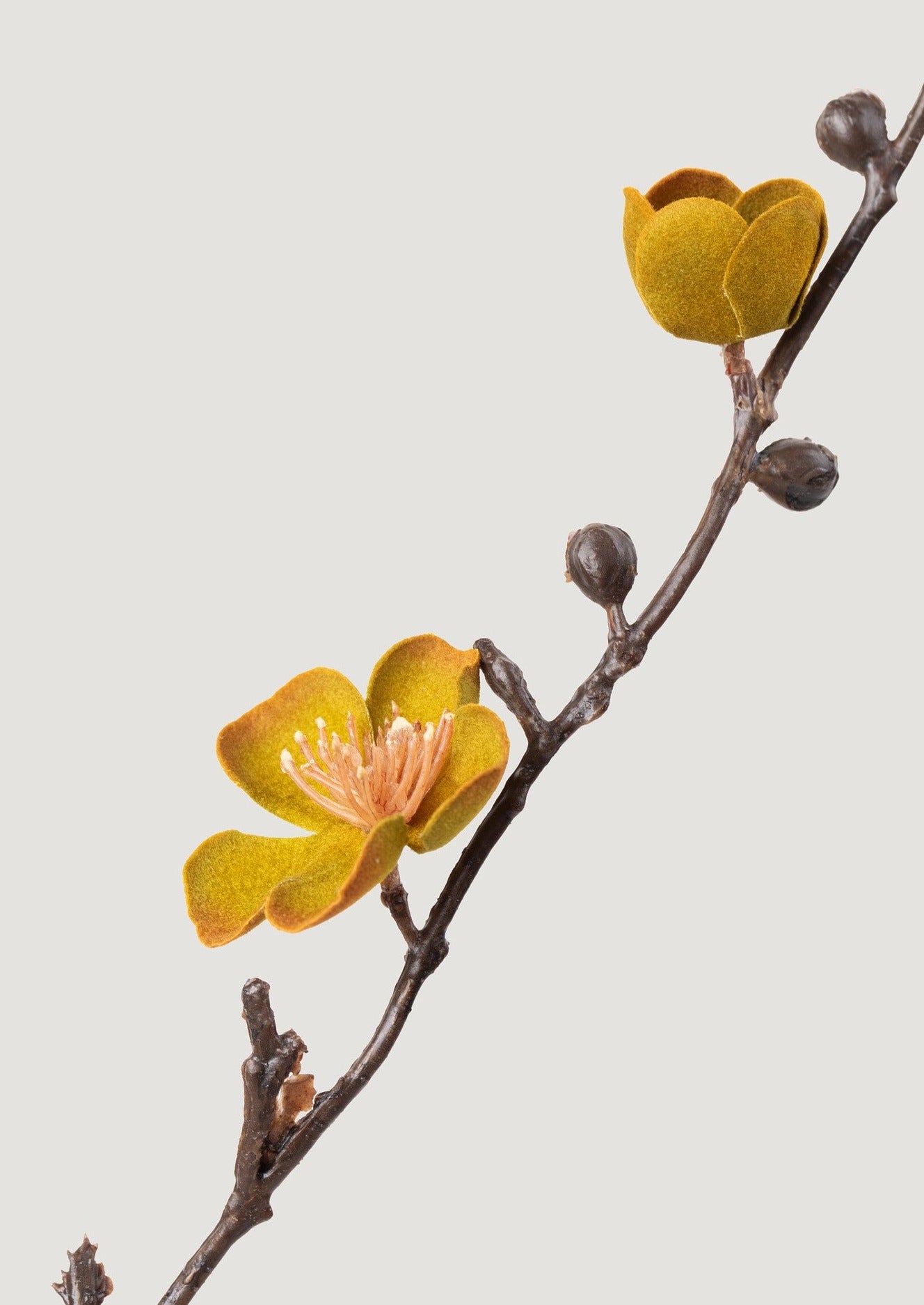 close-up of faux peach blossom branch