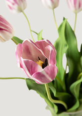 Close Up of Artificial Blooming Mauve Tulips in Glass Vase Arrangement