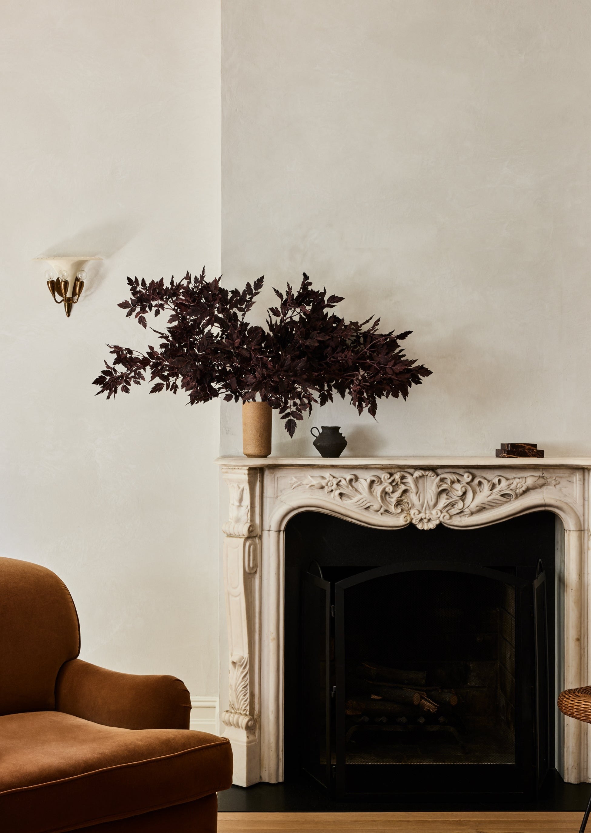 cimicifuga leaf spray arrangement on a mantel