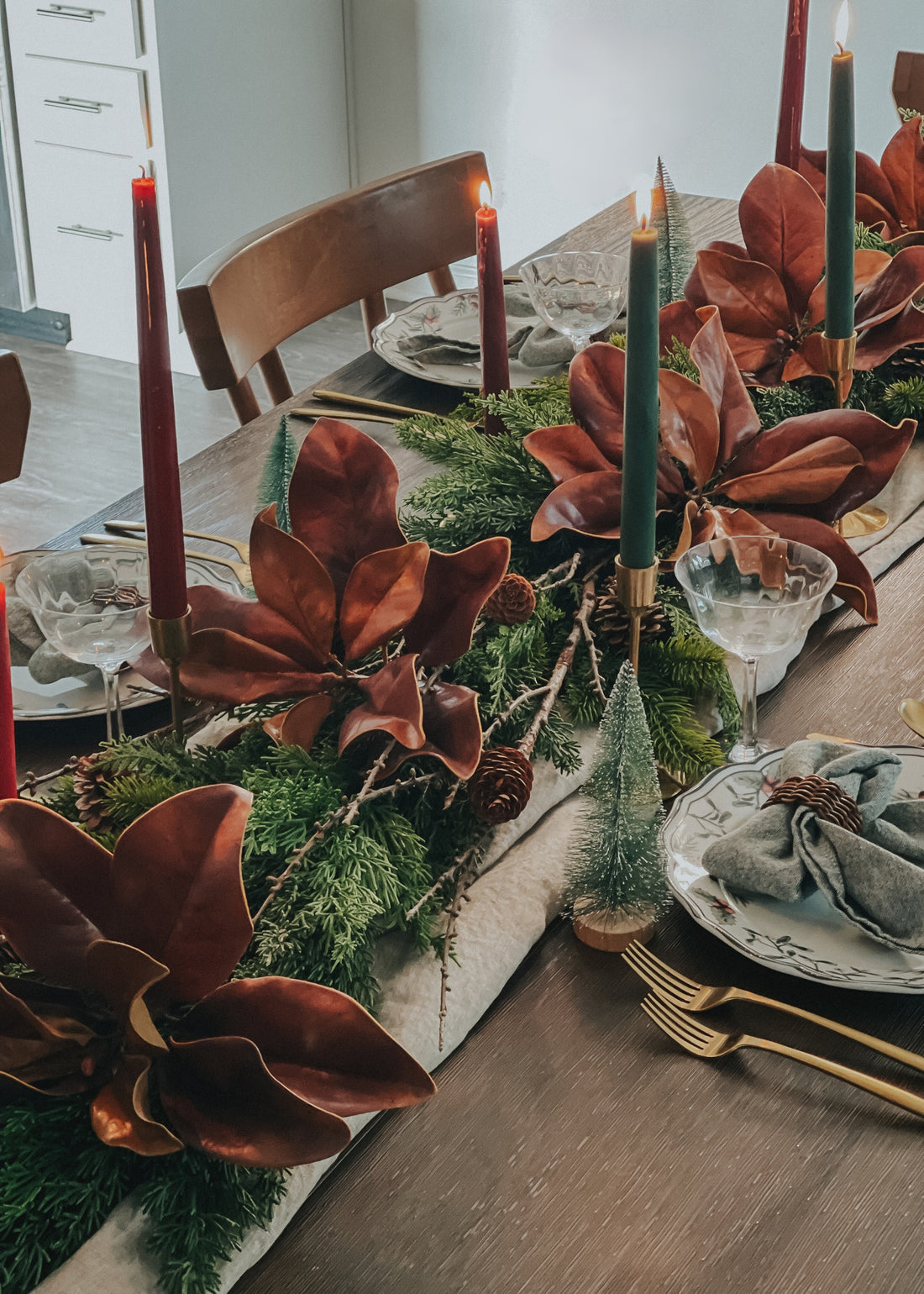 Rustic Holiday Tablescape with Magnolia leaves and Cedar Garlands