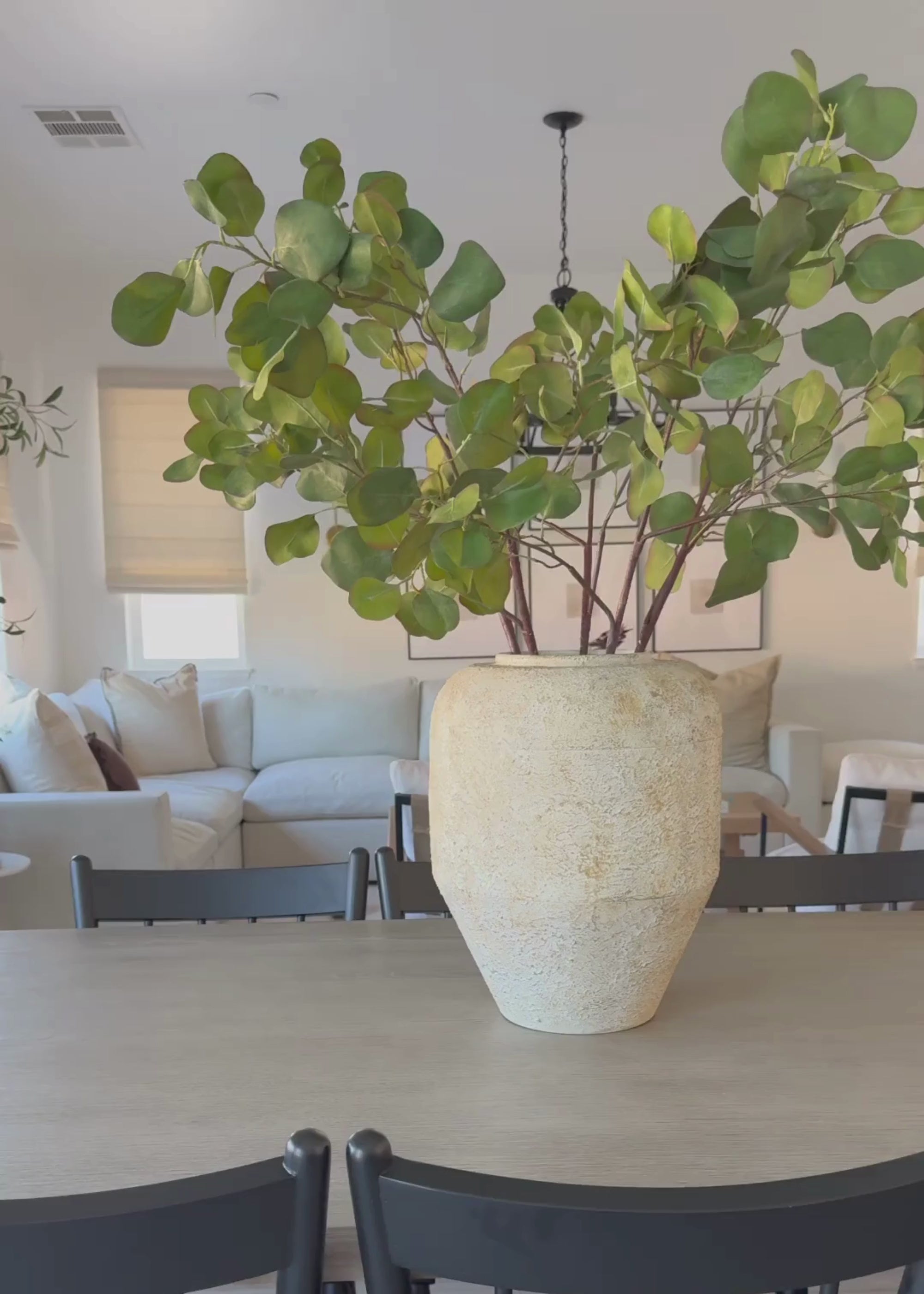 video of faux eucalyptus styled in vase