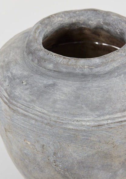 Close Up of Large Distressed Concrete Vase in Gray at afloral